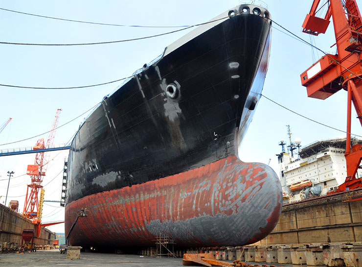 A liquefied natural gas tanker being repaired in a dry dock.