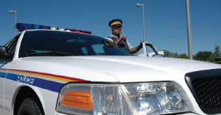 RCMP Officer with cruiser